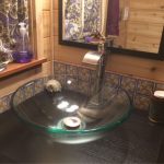 Glass bowl bathroom sink with vanity