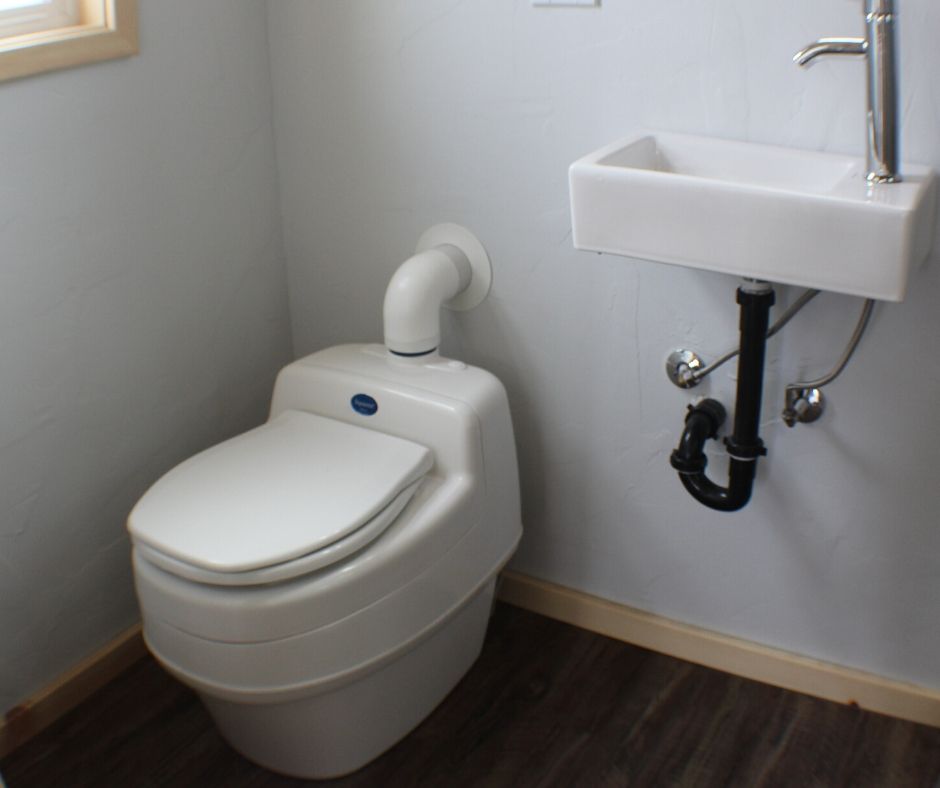 compost toilet next to sink