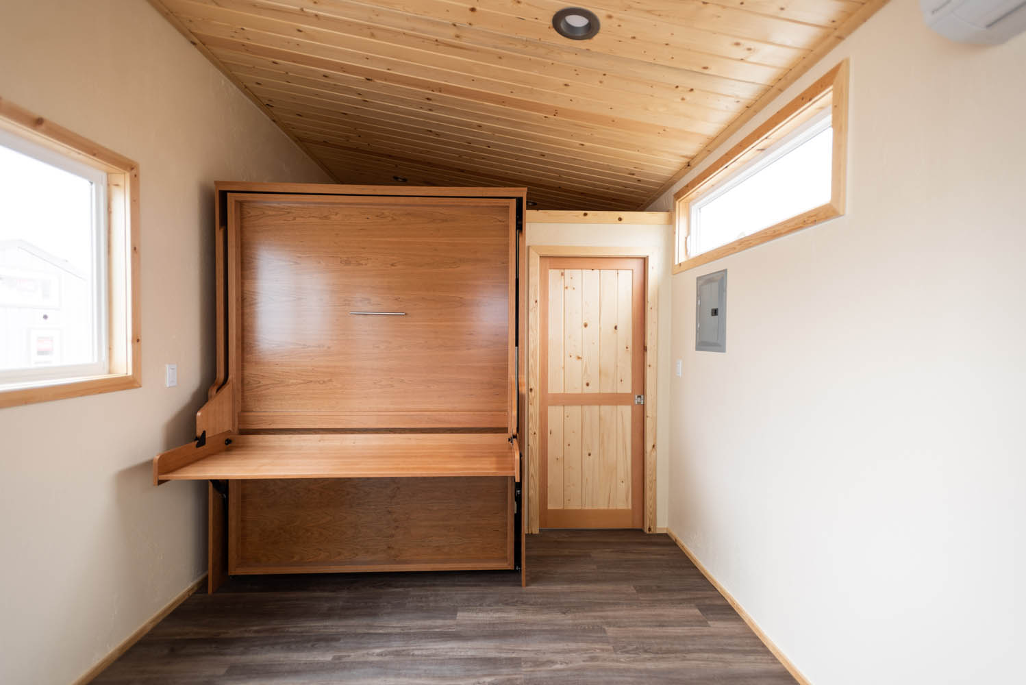 Murphy bed in desk position in ADA friendly tiny house