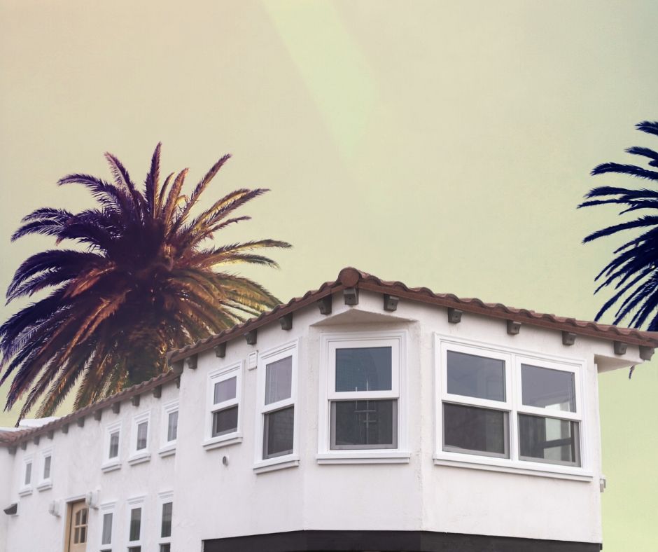 Monterey Villa gooseneck tiny house with palm trees in background